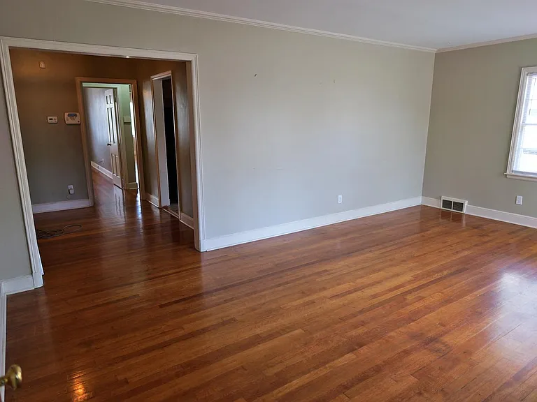 Living room. Dining room in room beyond.