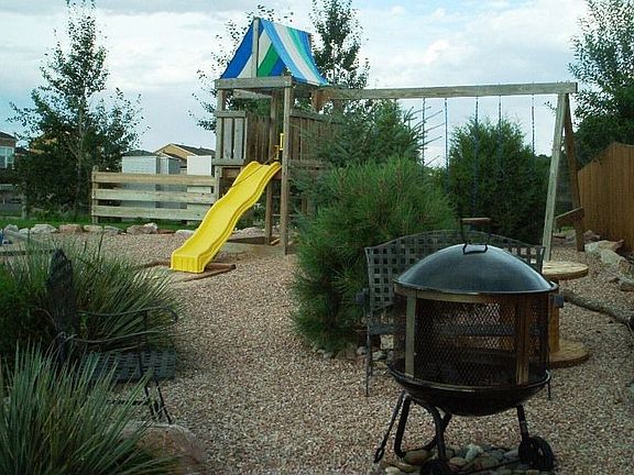 firepit, play area and sandbox
