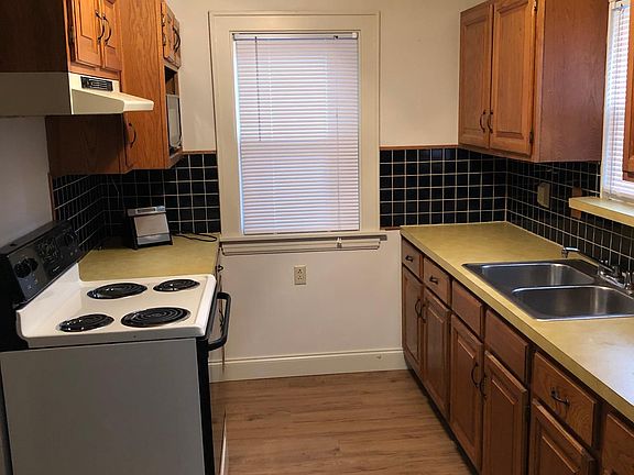 Cozy kitchen overlooks back yard and 2 car garage