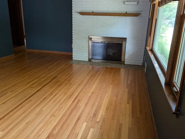 Main level - Living room with wood fireplace