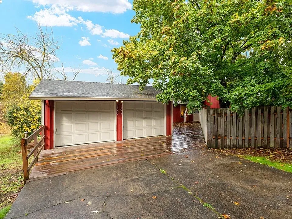 Duple shared driveway 392 on right. Private detached garage on right.