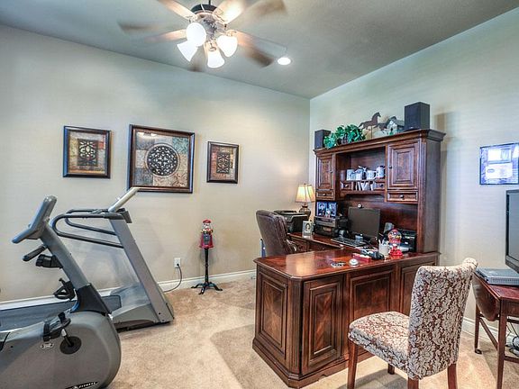 Study/ formal living room has french doors for privacy.