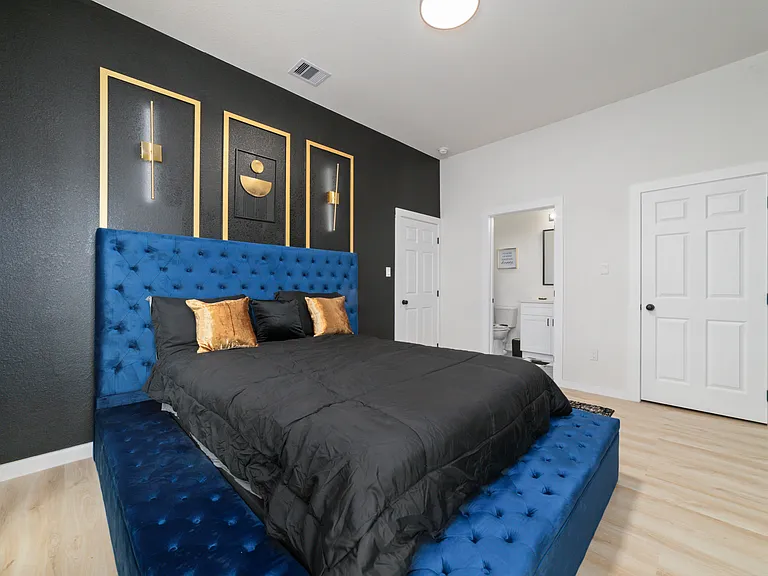 Master bedroom from window view, Queen size bed, 55 inch smart TV, connected private Restroom and full size private closet.