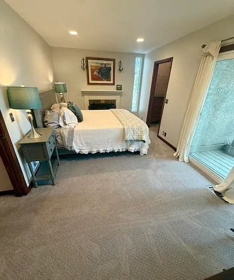 Second Story Primary Bedroom with Queen Plus Bed, Walk-In Closet, balcony and Gas Fireplace.