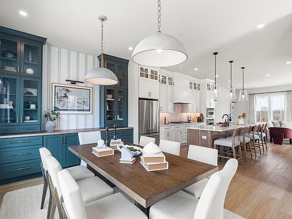 Spacious open-concept kitchen and dining area with 10 ceiling heights and dining room built-in cabi