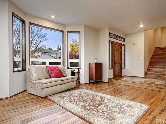 Bay windows in the living room brings more natural light in.  Notice the quality wood-wrapped, white vinyl windows!