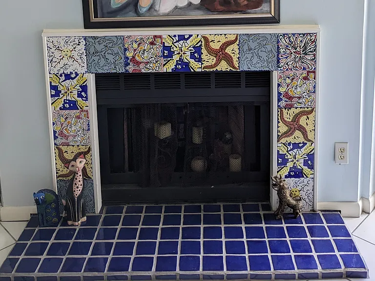 Salvador Dali tiles surround our beautiful (capped) fireplace. The Dali museum is only 24 miles from our condo.