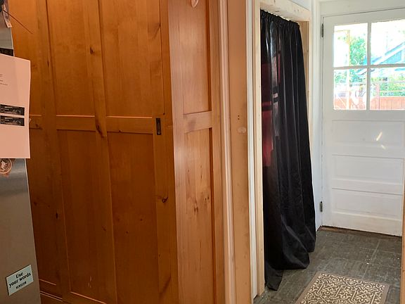 kitchen looking at back door into laundry room