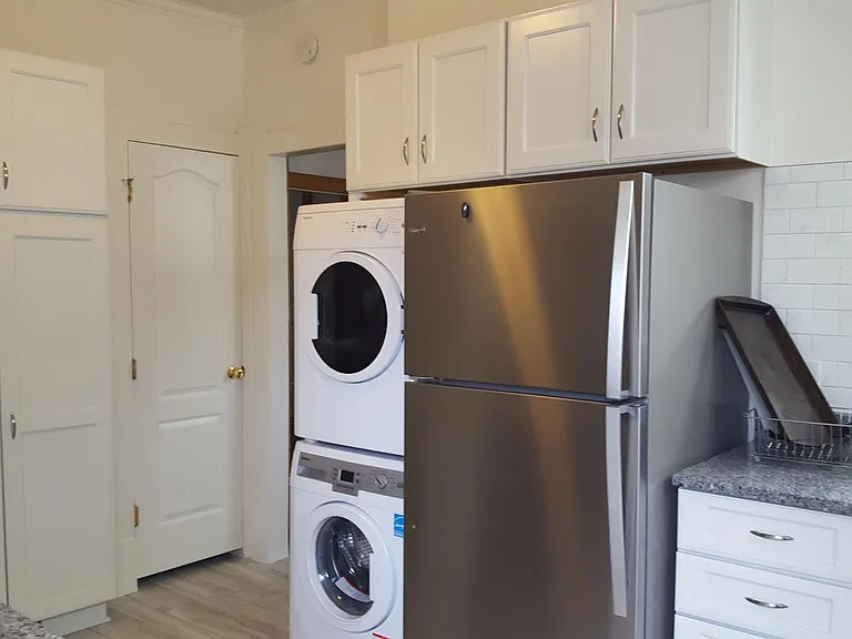 Kitchen with washer/dryer and lots of storage.