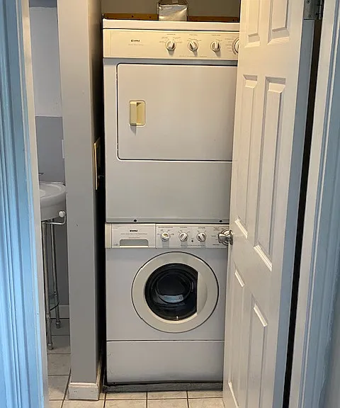 In-Unit stackable washer/dryer located in main bathroom