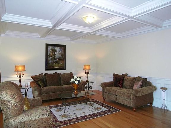 Formal Living Room Features Coffered
        Ceiling