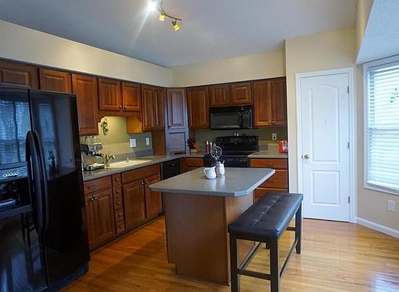 Updated and dynamic kitchen! Look at the cute stack of drawers near the sink!
