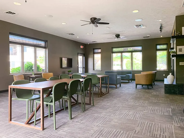 Plenty of seating and natural light make this community lounge an inviting spot to work, study, or socialize.