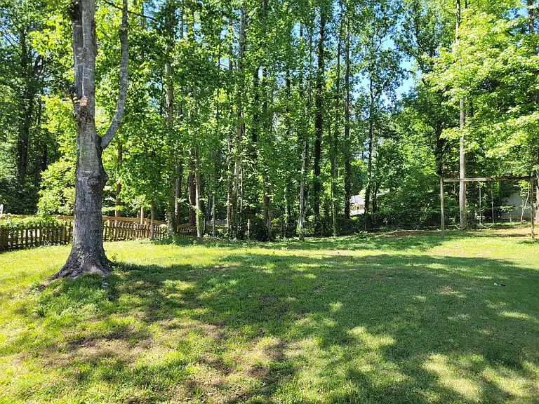 Large usable private fenced backyard.