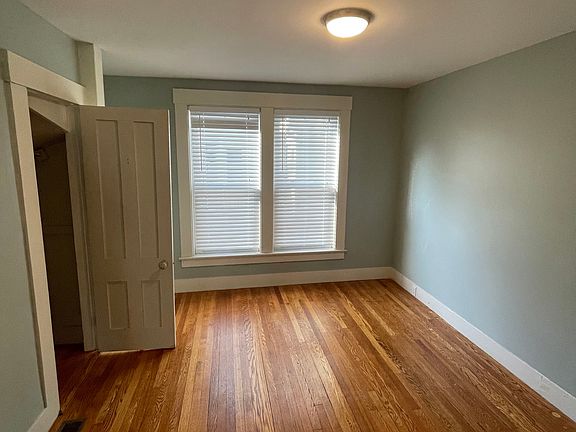 Bedroom / office off living room with hardwood floor