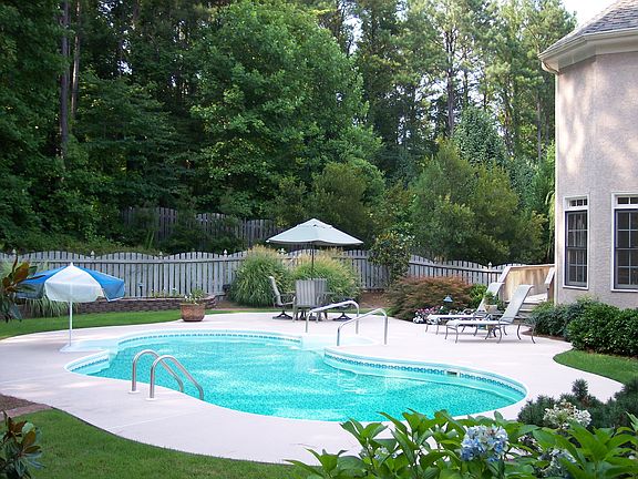 Beat the heat in your own inground pool or just relax in the private backyard.