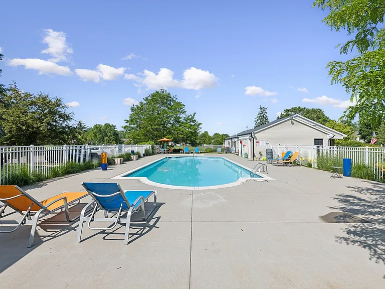 Enjoy our pool area featuring comfortable seating and beautiful tree-lined surroundings, professionally operated by Highlands Vista Group.