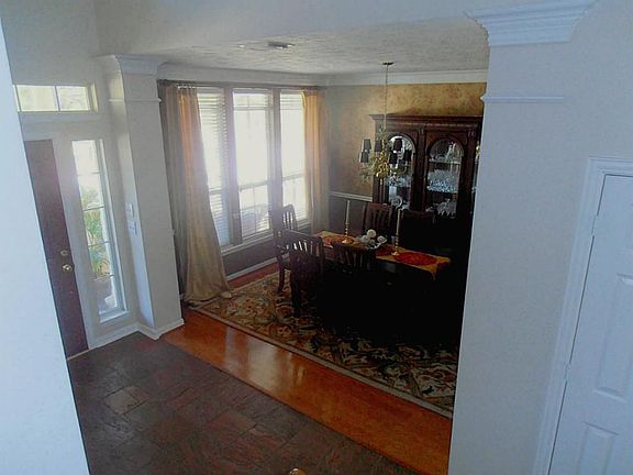 Another view of the formal dining looking out onto the front porch.  Note the beautiful wood floors.