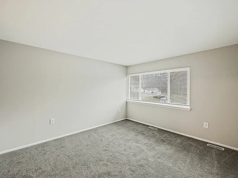 Experience the comfort of this bright and airy room, perfect for personalization.
