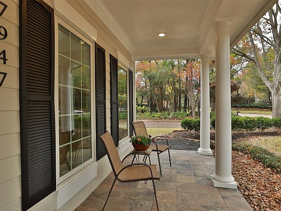 Charming Slate Front Porch with Recessed Lighting is Perfect to Enjoy your View of...