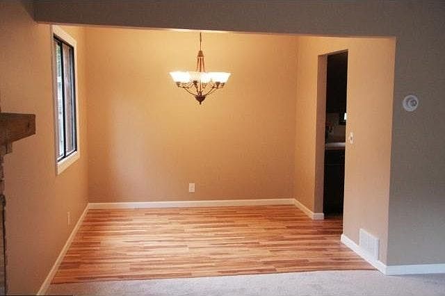 Dining Room with updated flooring & lighting