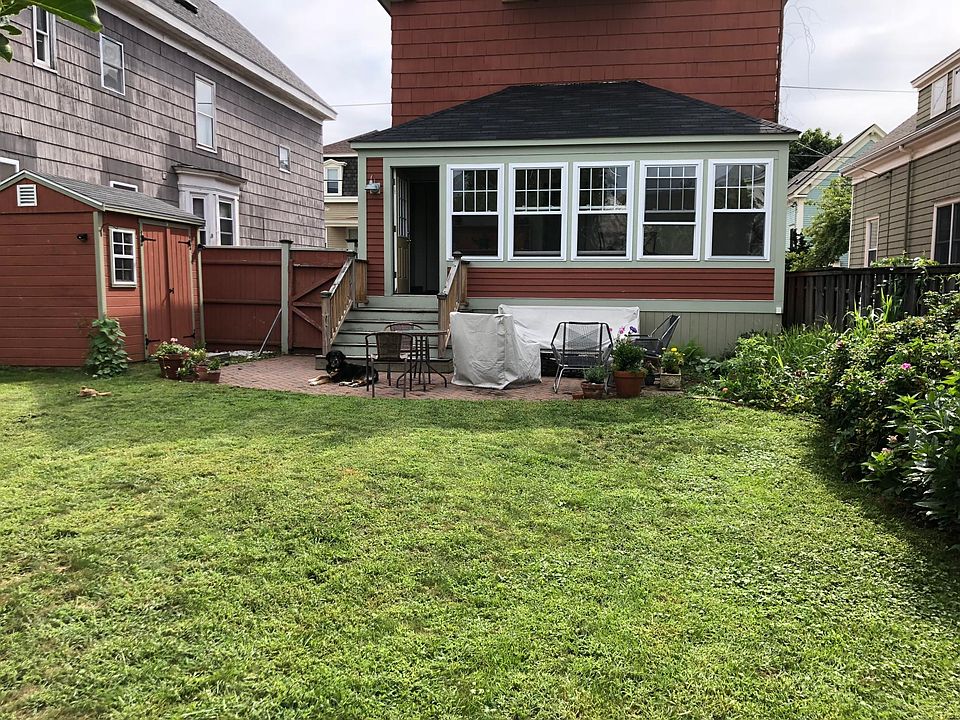 Shared fenced in backyard with patio.