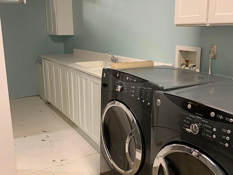 Laundry room with additional storage