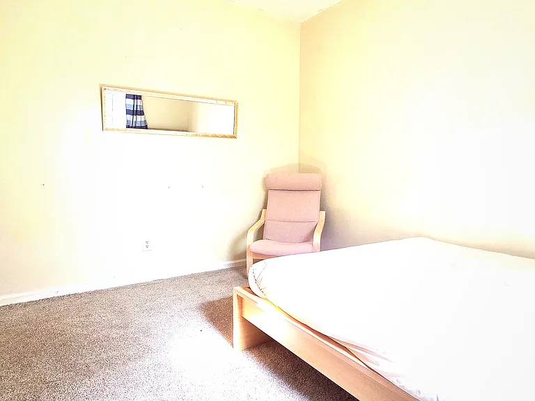 Fully furnished bed room with bed, mattress, walk in closet, arm chair. mirror, lamp, curtains, computer table/chair and private entry to the shared bathroom