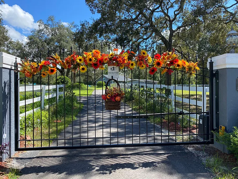 This front gate was just installed a few months ago. It works with a remote and keypad. The owner decorates the gate timely to match the holiday and seasons.
