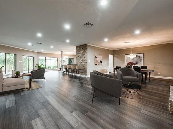 A staged photo to try and help you imagine where to place furniture in this open floor plan.