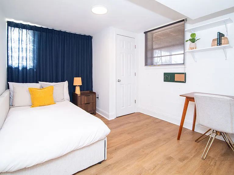 Secondary bedroom (full size bed). Can be used as a dedicated workspace or walk-in closet.