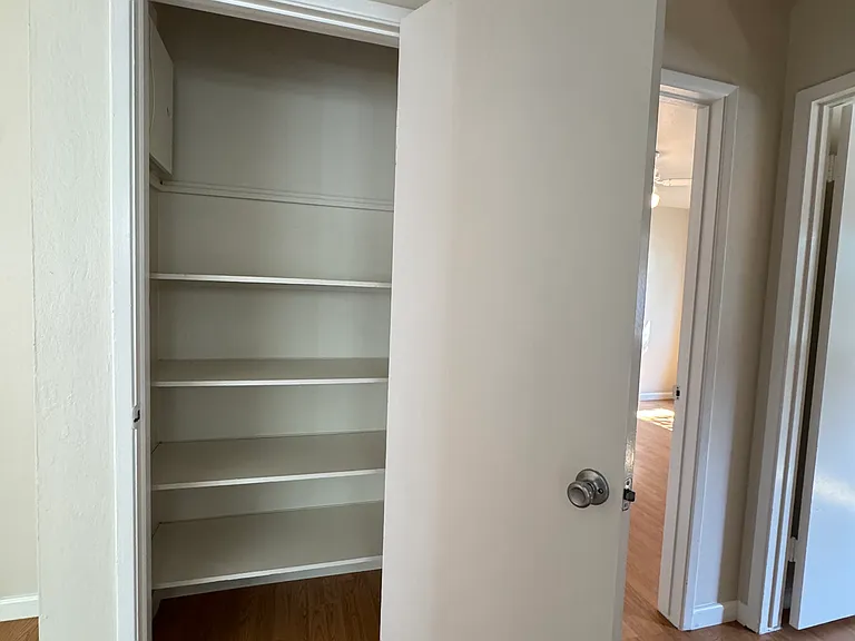 Inside of hallway closet of 2BR