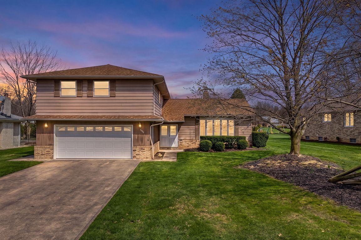 Beautiful curb appeal at dusk with a welcoming entry and spacious two-car garage.