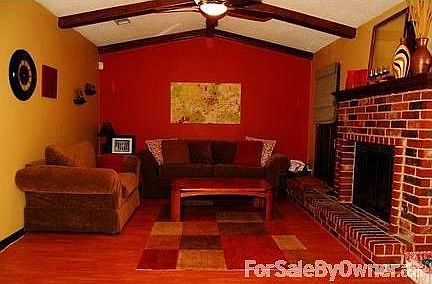 Den w/ Fireplace						:						This room is at the back of the house off of the breakfast area.
