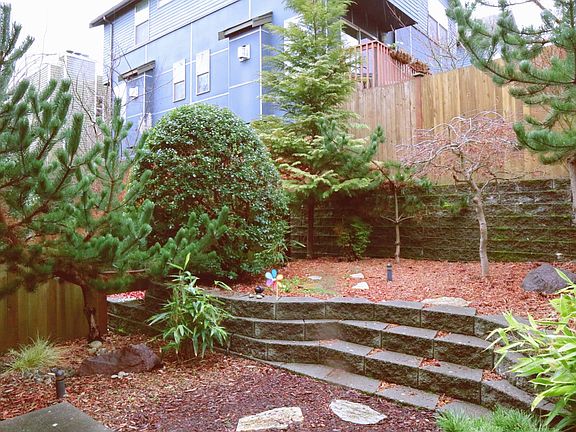 Fully fenced landscaped backyard.
