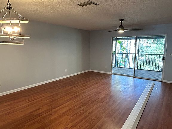 Living room on main level. Excuse the baseboard. Second screened in porch off the living room.