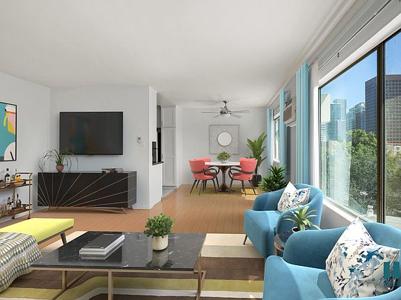 Open-Conecpt Dining and Living Room Space with Large-Size Windows and Vinyl Flooring