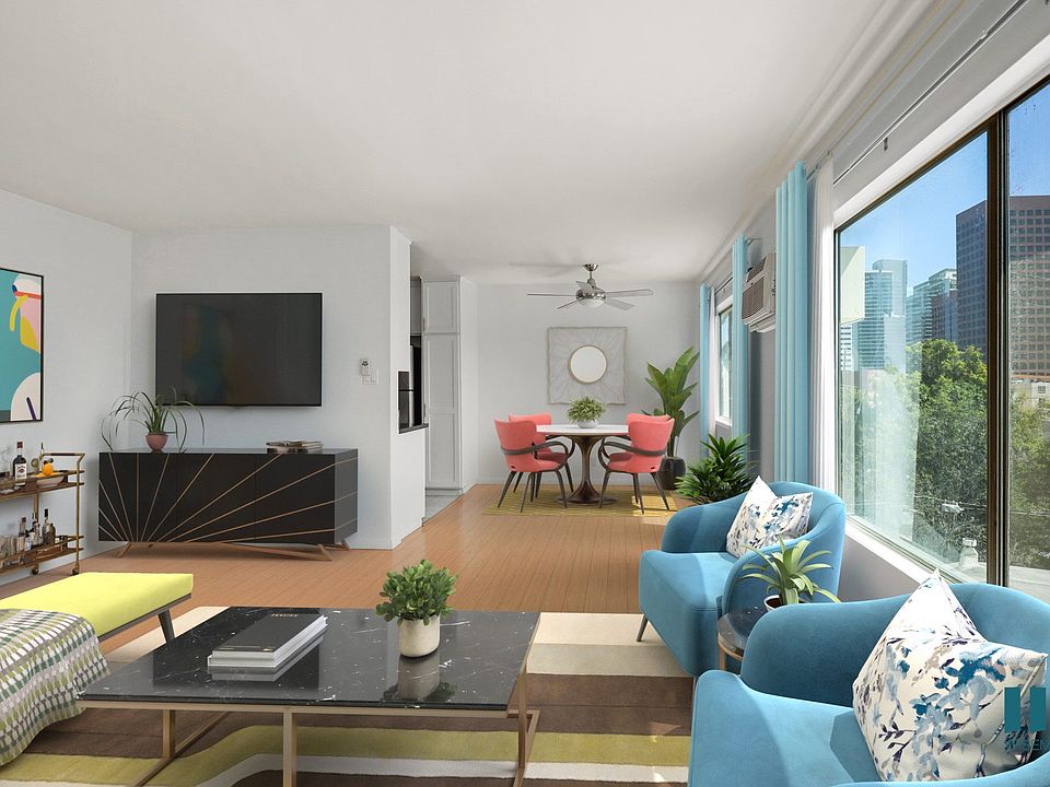 Open-Conecpt Dining and Living Room Space with Large-Size Windows and Vinyl Flooring