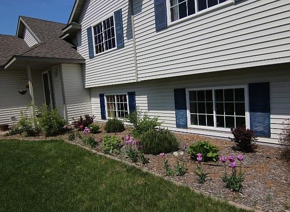 Great landscaping on a lush yard backing to nature and wetlands!