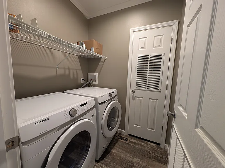 Laundry room. Furnace area with central air conditioning.