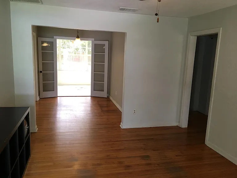 Looking from living room through dining room to enclosed Florida room