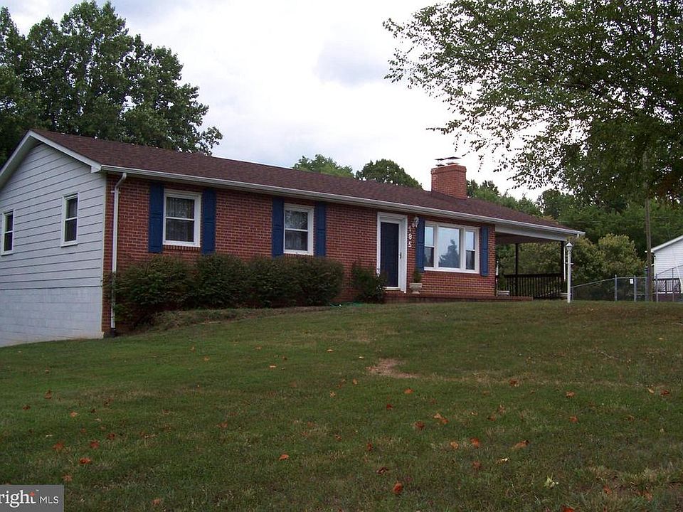 Large yard surrounds this attractive rambler.