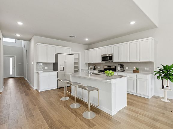 Kitchen in the Winters home plan by Trophy Signature Homes - REPRESENTATIVE PHOTO