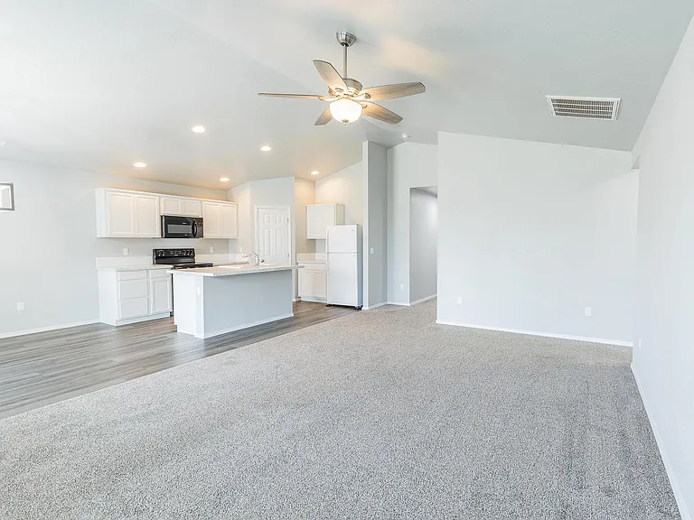 Open living room layout w/ vaulted ceiling