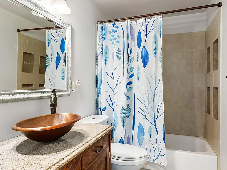 Upper floor full bathroom. Tile floors & tile surround in shower/tub.
