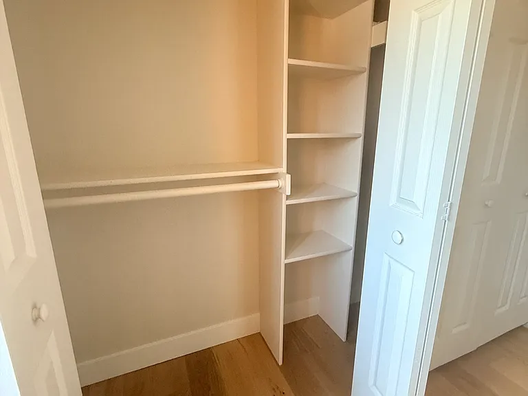 Upper closet with built-in shelving