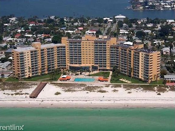 Building with olympic size pool facing the beach.