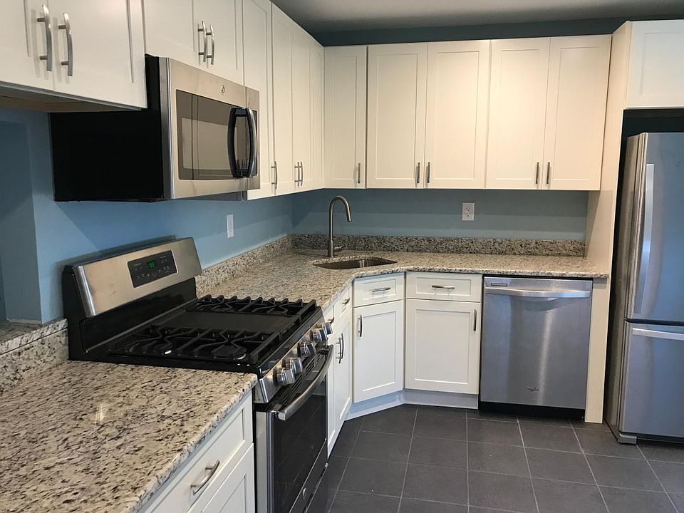 Brand new kitchen with granite counter tops, and SS applianc