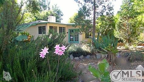 Nestled on woodsy  (almost)  half-acre, with lovely grounds to meander and roam.