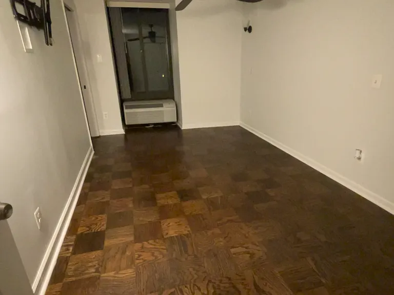 Main bedroom. Includes fan and TV rack.